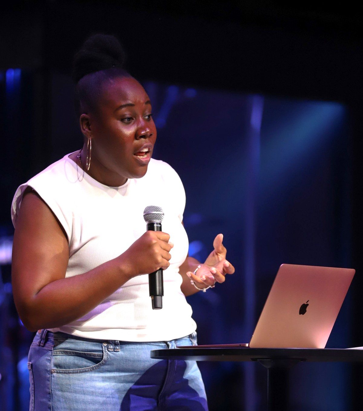Jessica Robinson-Grant speaking on stage with a microphone